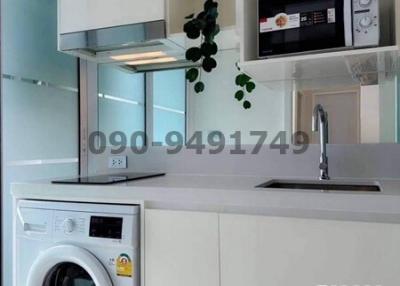 Modern kitchen with white appliances and fixtures