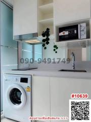 Modern kitchen with white appliances and fixtures