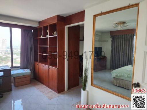 Spacious Bedroom with Large Wardrobe and Mirror