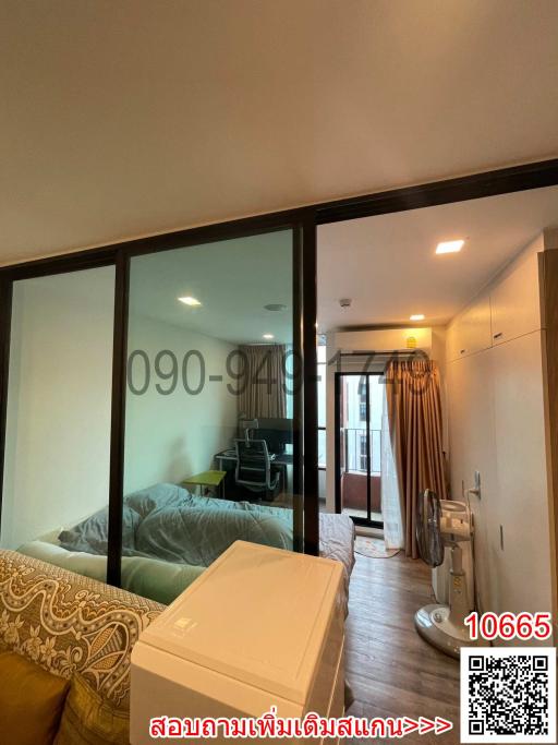 Cozy bedroom with glass sliding doors and balcony access