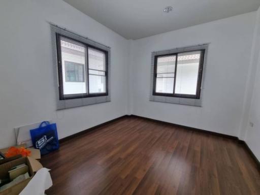 Bright and empty bedroom with hardwood floors