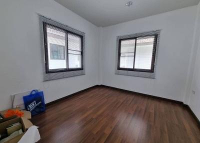 Bright and empty bedroom with hardwood floors