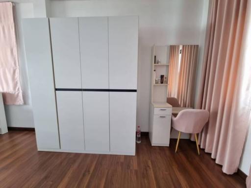 Spacious bedroom with large wardrobe and study area