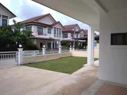 Spacious residential home exterior with front yard