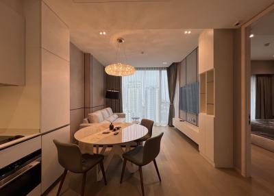 Modern living room with dining area and city view