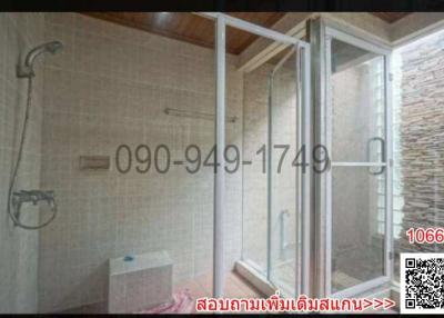 Modern bathroom interior with glass shower and textured tiles