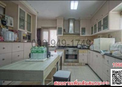 Spacious kitchen with modern appliances and ample storage space