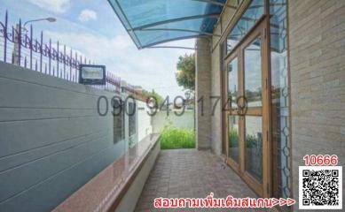 Exterior view of a building with glass doors and awning