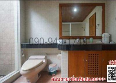 Modern bathroom with wooden cabinet and mirror