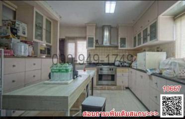 Spacious kitchen with modern appliances and ample cabinetry