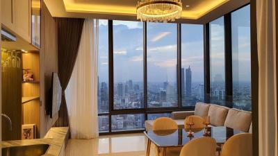 Elegant living room with panoramic city view through floor-to-ceiling windows