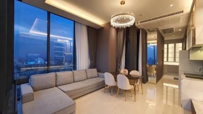 Modern living room with city view and open plan dining area