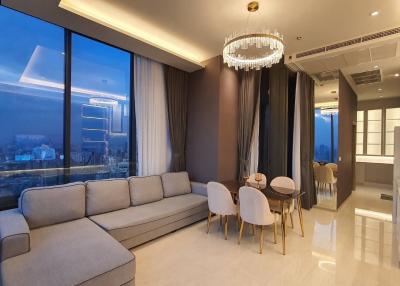 Modern living room with city view and open plan dining area