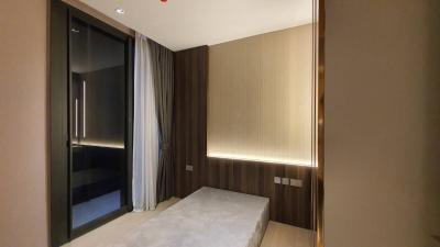 Modern bedroom with a large bed and stylish lighting