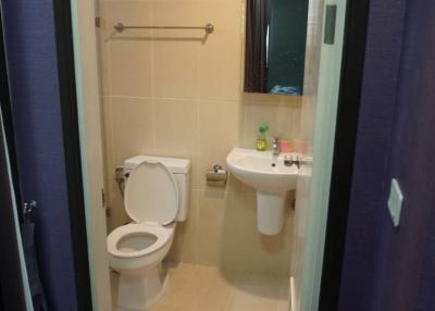 Compact bathroom with toilet and sink