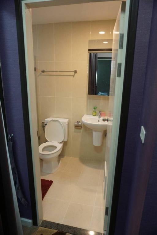 Compact bathroom with toilet and sink