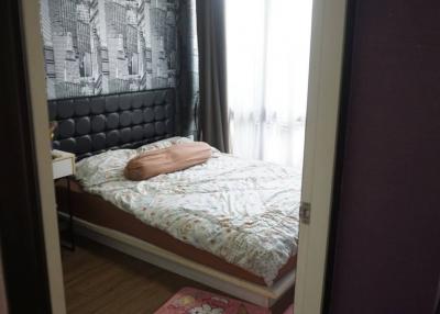 Cozy bedroom with modern wallpaper and natural light