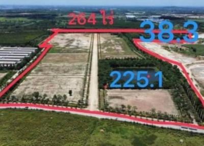 Aerial view of a large land plot with demarcation lines and measurements