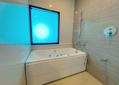 Modern bathroom with a large bathtub and shower