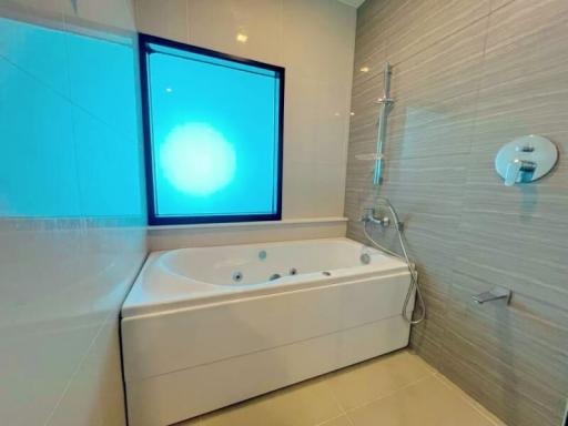 Modern bathroom with a large bathtub and shower