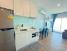 Modern kitchen with stainless steel appliances and open plan layout