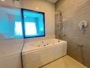 Modern bathroom interior with jacuzzi tub and tiled walls