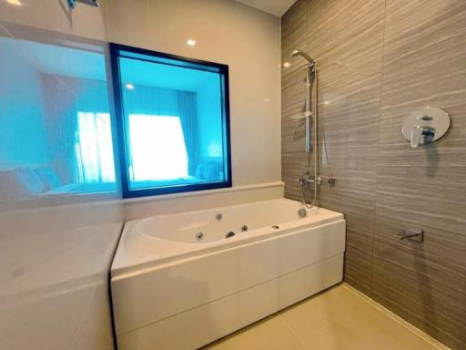 Modern bathroom interior with jacuzzi tub and tiled walls