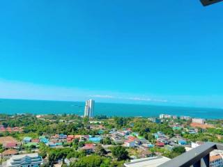 Breathtaking high-rise coastal view overlooking a vibrant city and blue ocean