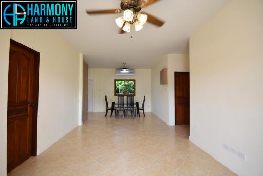 Spacious dining room with tiled flooring and natural light