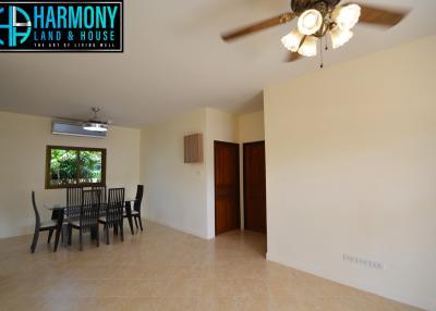 Spacious dining area with ceiling fan and natural light