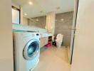 Modern bathroom with laundry facilities and bidet