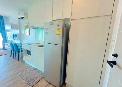 Modern kitchen with stainless steel appliances and a dining area