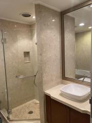 Modern bathroom with glass shower and elegant vanity