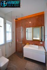 Modern bathroom interior with glass shower and large mirror