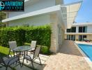 Modern two-story house with pool and outdoor sitting area