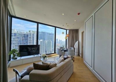 Spacious living room with modern furniture and city skyline view