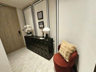 Elegant modern hallway interior with decorative furniture and wall paneling