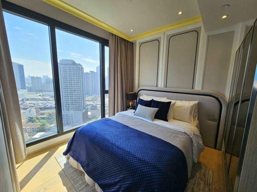 Cozy Bedroom with Large Windows and City View