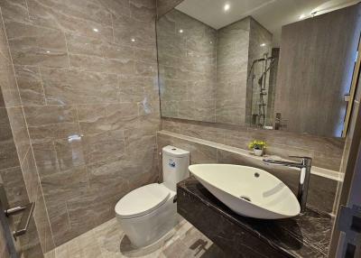 Modern bathroom interior with elegant fixtures and neutral tile design
