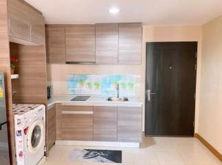 Modern kitchen with wooden cabinets and white appliances