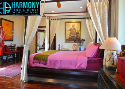 Spacious bedroom with traditional decor and hardwood floors