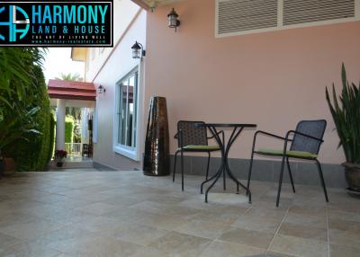 Spacious outdoor patio with comfortable seating and privacy