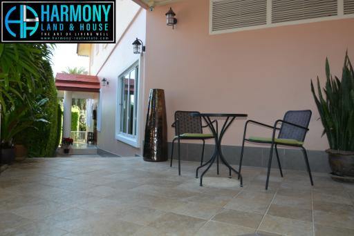 Spacious outdoor patio with comfortable seating and privacy