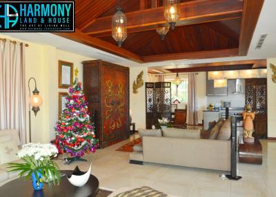 Spacious living room with high ceilings and traditional decor