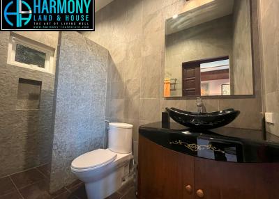 Modern bathroom interior with grey tiles and elegant fixtures