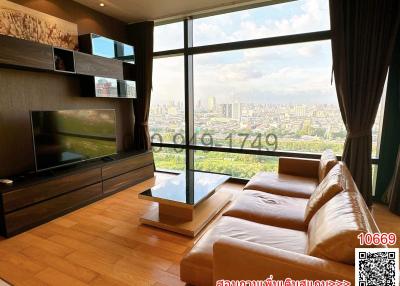 Modern living room with large windows offering a city view
