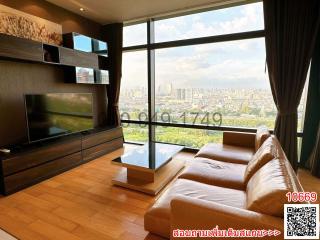 Modern living room with large windows offering a city view