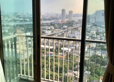 City view from high-rise apartment with large windows