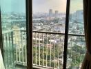 City view from high-rise apartment with large windows