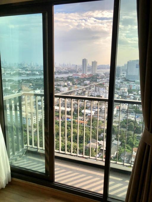 City view from high-rise apartment with large windows